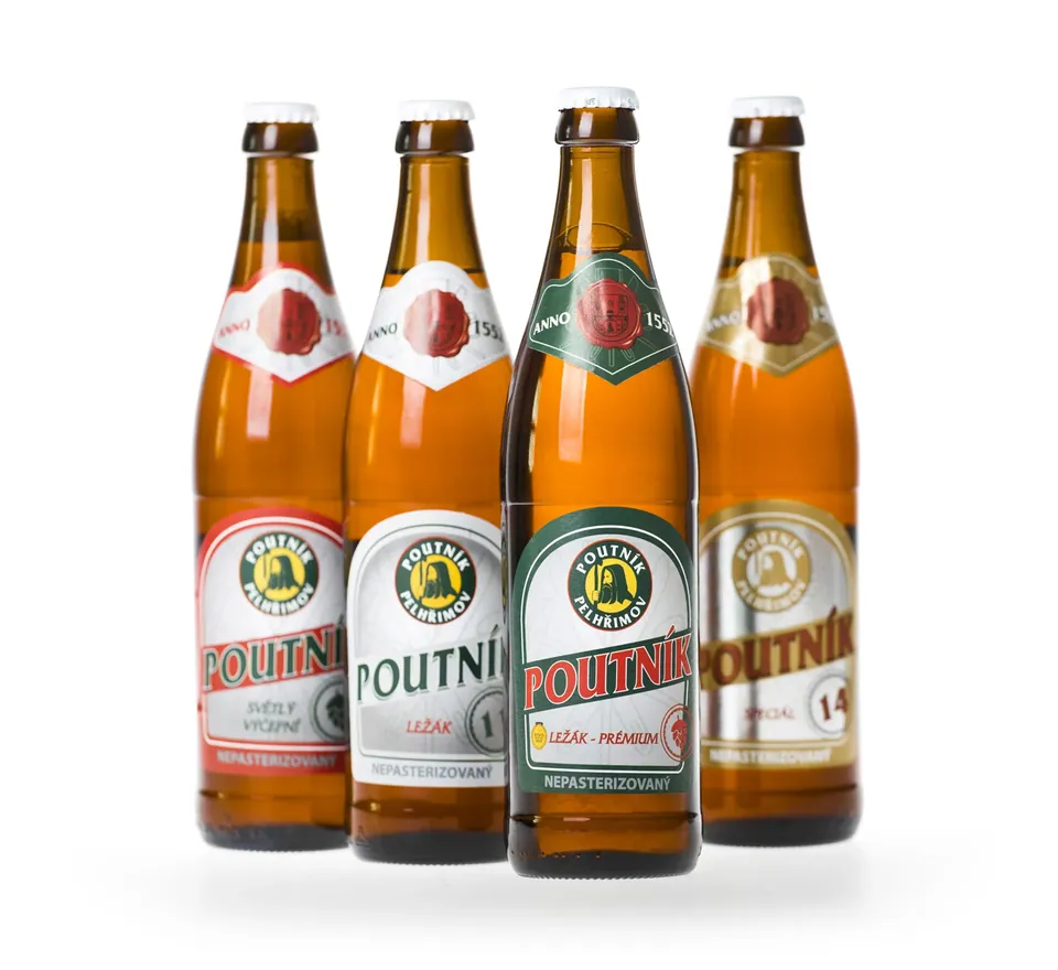 Four bottles of Poutník – light draught, lager 11, lager Premium and special 14 – with labels reading Nepasterizovaný (unpasteurised) and Anno 1552